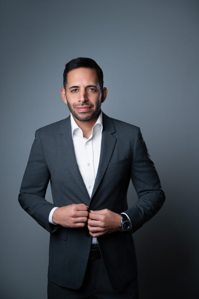 Nicholas Mukhtar, founder of Tera Strategies, in a grey suit